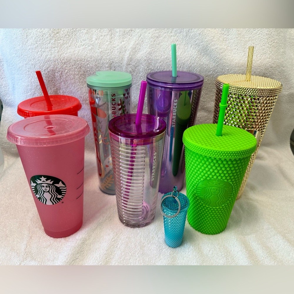 Set of 7 Starbucks cups and a keychain